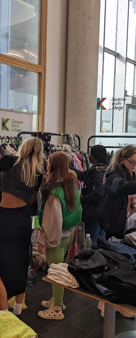 Students taking part in a clothes swap Students taking part in a clothes swap